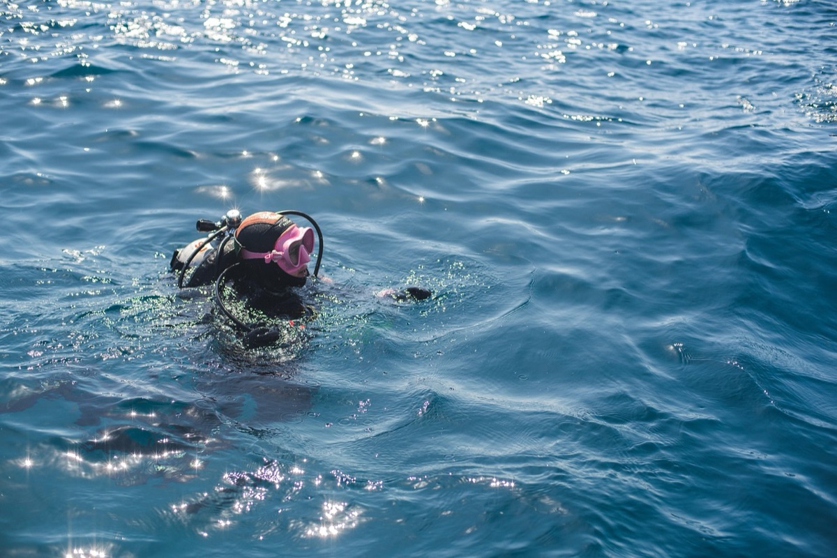 diver snorkeling in clear water