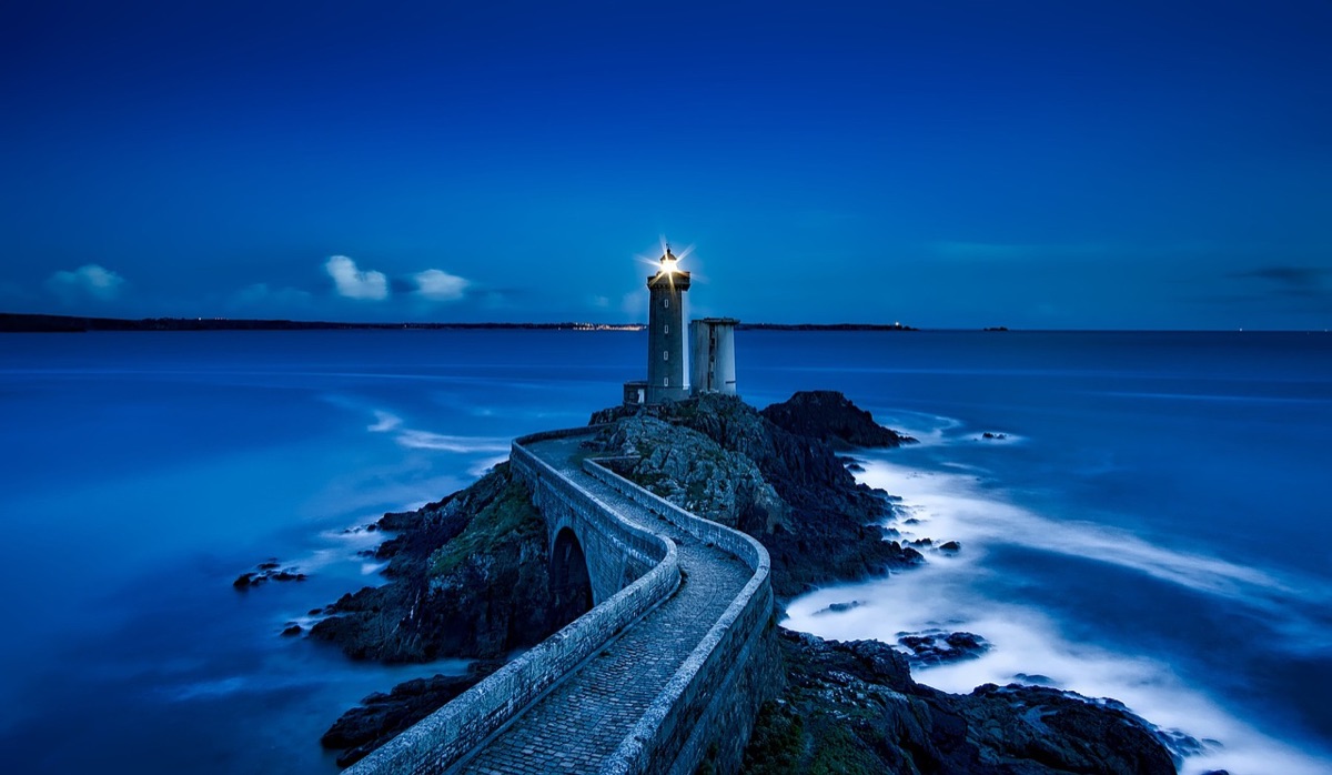 Palau lighthouse at night, highlighting the island's natural and cultural significance.