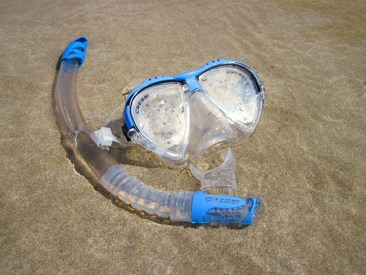 Dive mask and snorkel on coral reef
